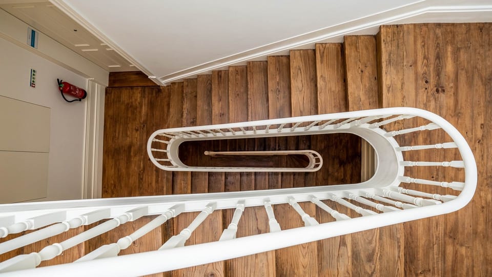 Discover a unique architectural gem as you ascend or descend this elegant spiral wooden staircase, adding a touch of classic charm and character to your stay. #SpiralStaircase #ArchitecturalGem #WoodenStairs #UniqueDesign #CharmingStay #ElegantDetails #Mu