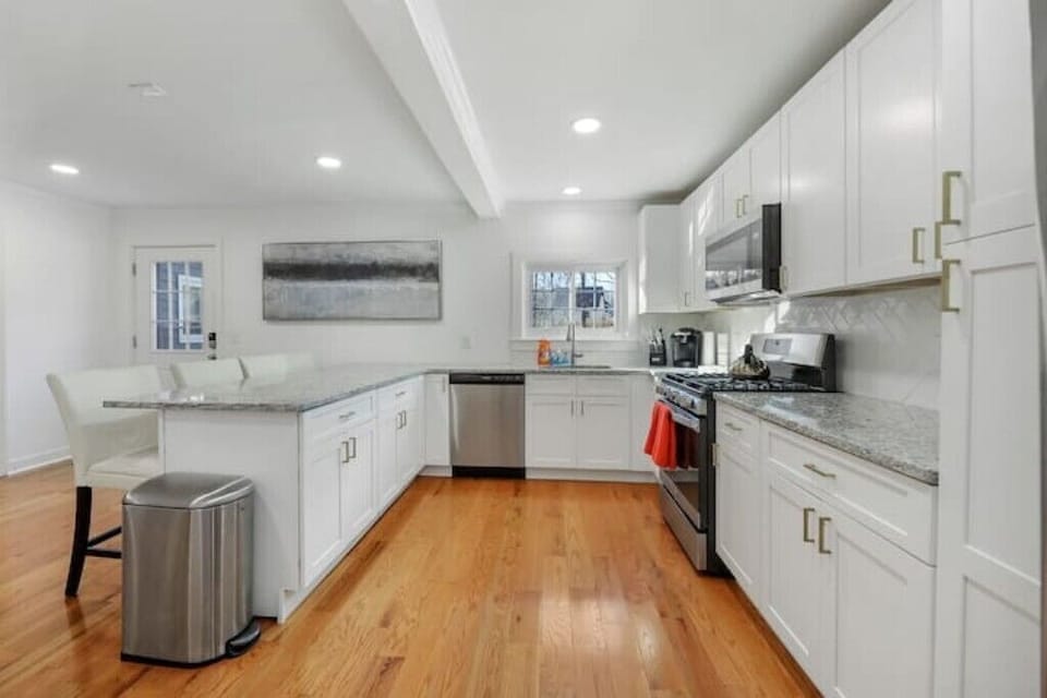 Well-appointed kitchen with stainless steel stove, refrigerator, and microwave. 