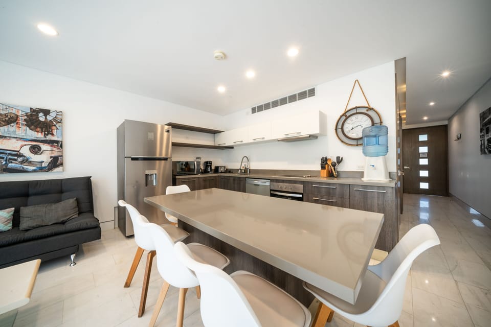 Design Condo | Private kitchen | Full-size fridge, microwave, toaster