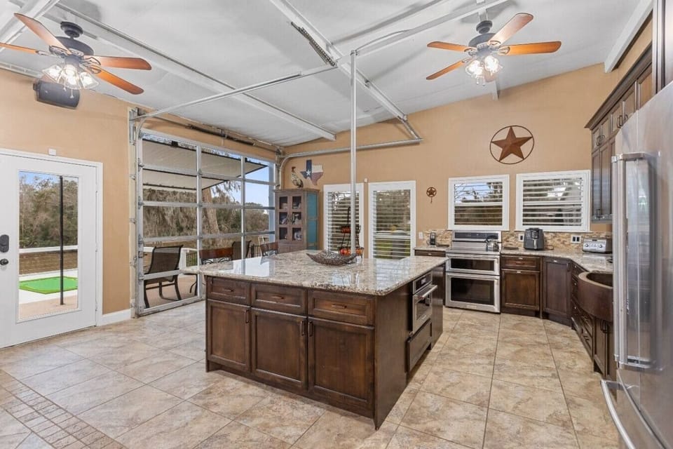 Full kitchen with island seating — ideal for cooking, snacking, & gathering.