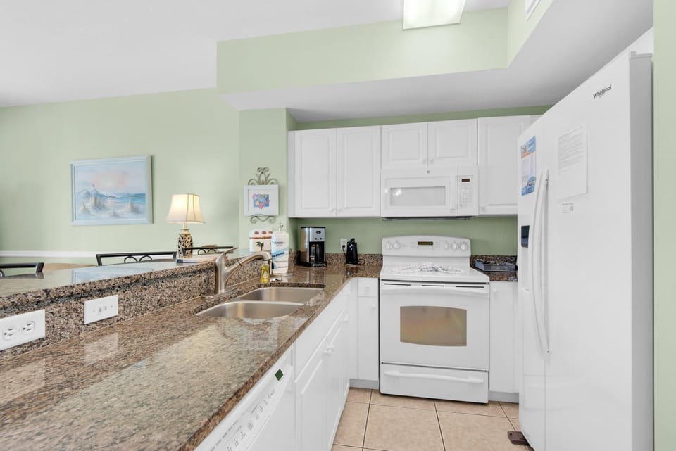 Condo, 1 King Bed with Sofa bed (Celadon 703) | Private kitchen | Oven, toaster