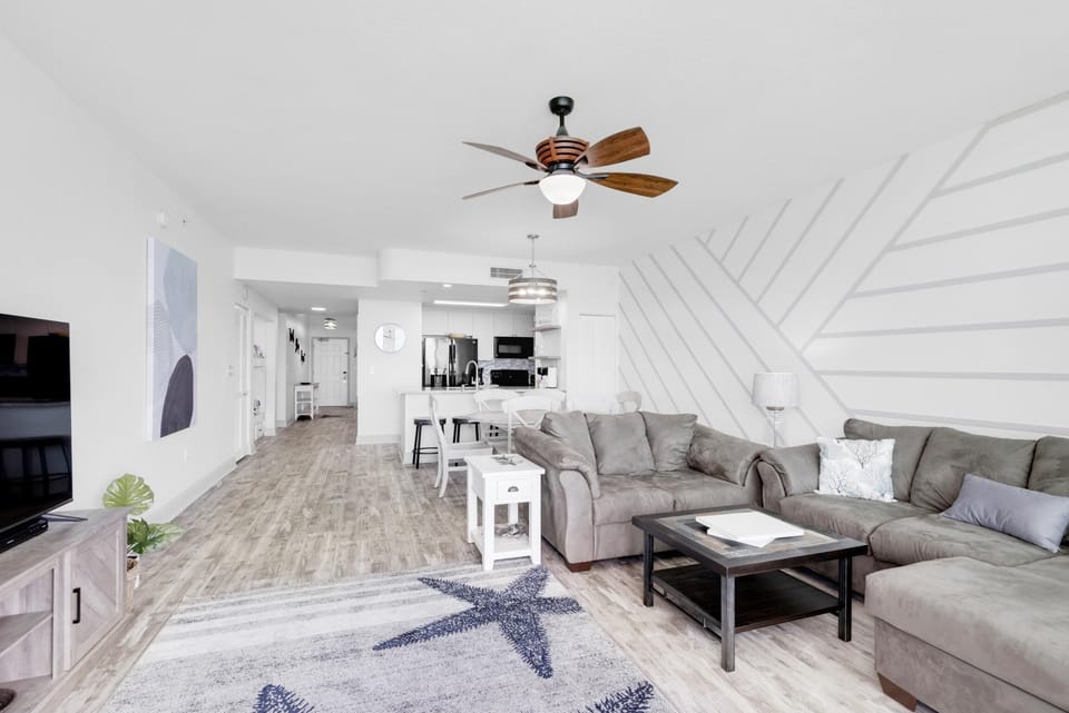 Condo, Multiple Beds (Aqua Resort 1705) | Living area | TV