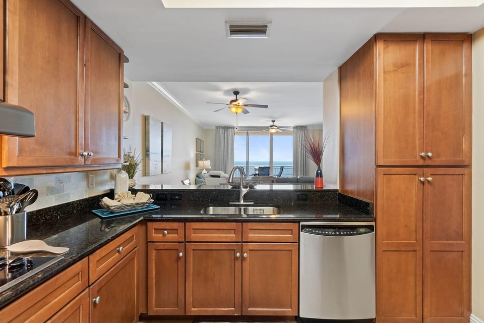 Condo, Multiple Beds (Indigo East 1405) | Private kitchen | Oven, toaster, paper towels