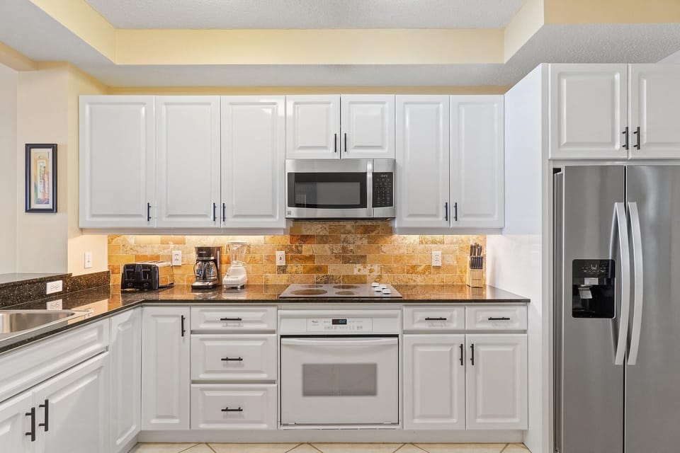 Condo, Multiple Beds (Beach Colony East 9C) | Private kitchen | Oven, toaster, paper towels