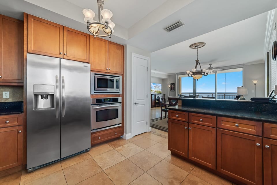 Condo, Multiple Beds (Indigo East 906) | Private kitchen | Oven, toaster, paper towels