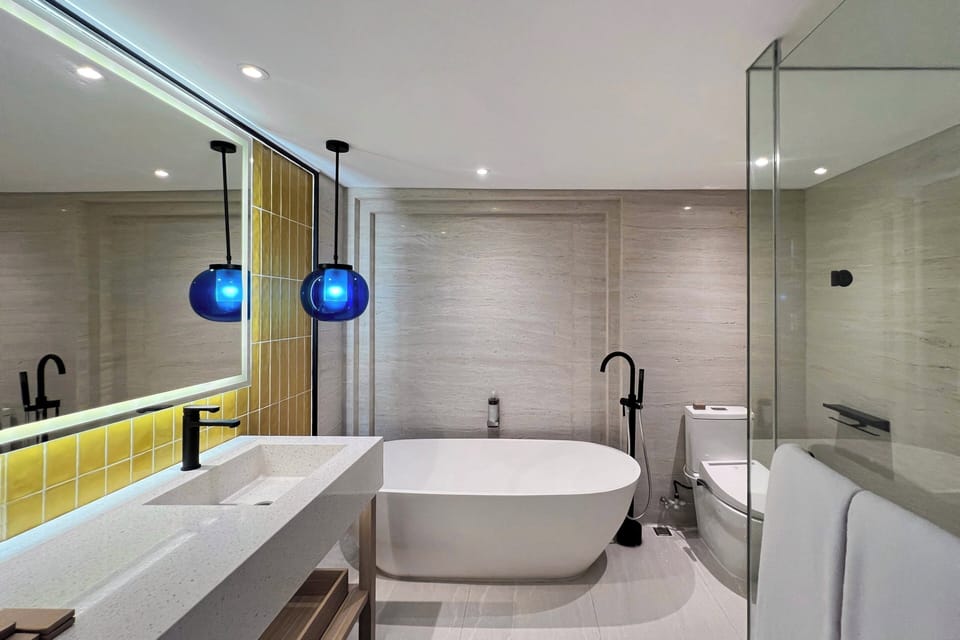Separate tub and shower, rainfall showerhead, free toiletries
