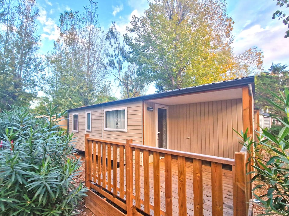 Enjoy serene moments on your private deck, nestled among lush greenery for a peaceful retreat.