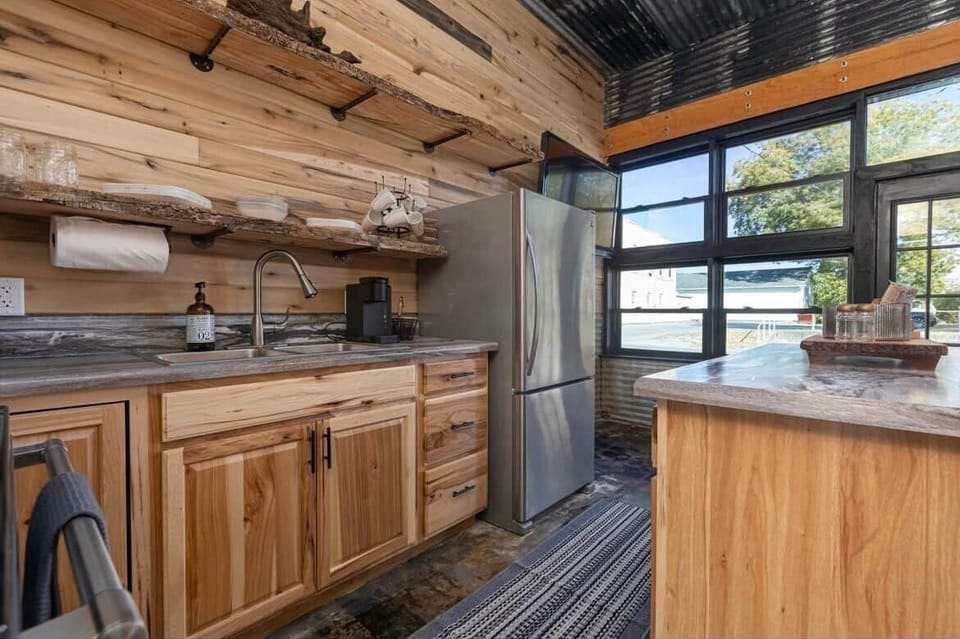 Full kitchen with a stove, sink, and microwave. Coffee maker and coffee provided to enjoy your morning river views.