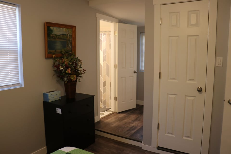 Master Bedroom with dresser, closet and private bathroom (3)