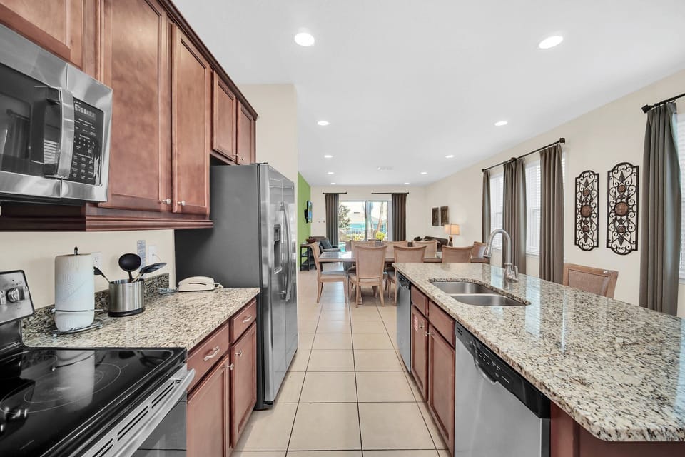 Spacious kitchen flowing into the living room—ideal for keeping families connected while cooking and relaxing.
