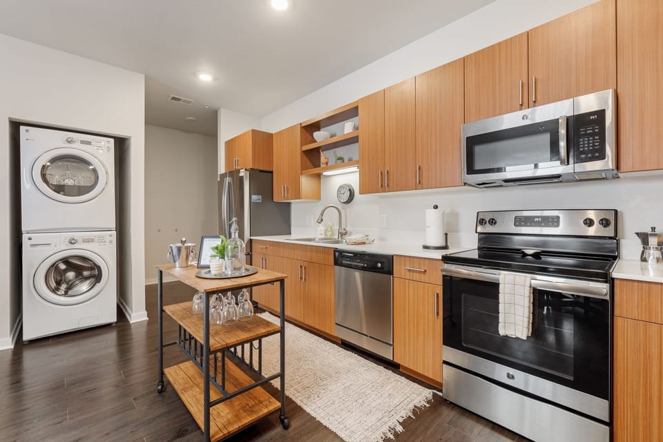 Spacious kitchen w/ stainless steel appliances & in-unit washer & dryer