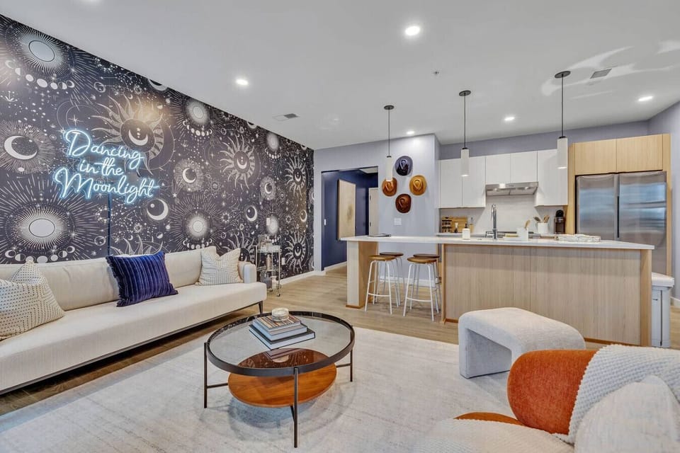 Living room, breakfast bar, and fully equipped kitchen