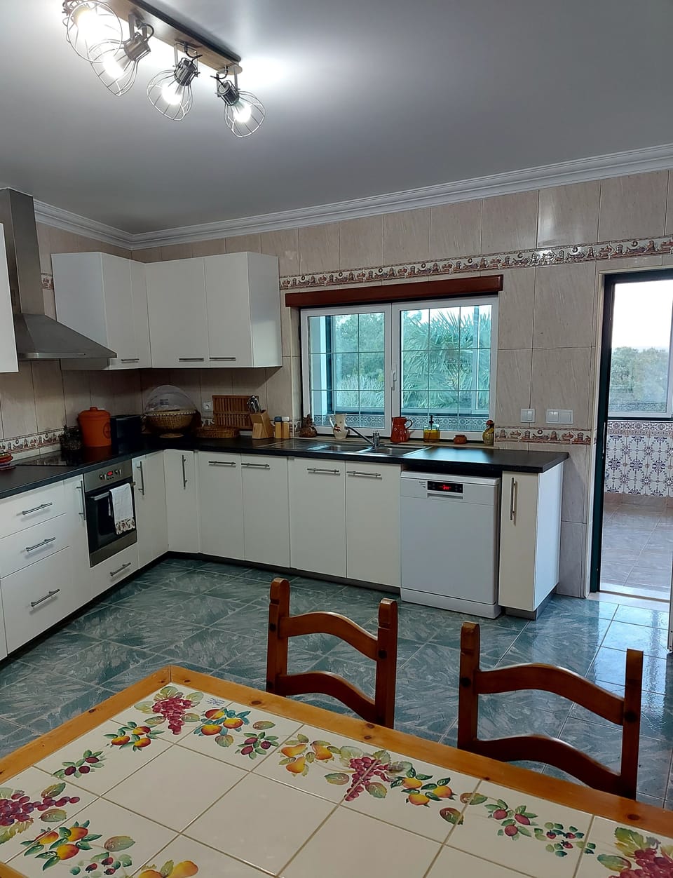 Well equipped kitchen-diner leading on to  an indoor BBQ area