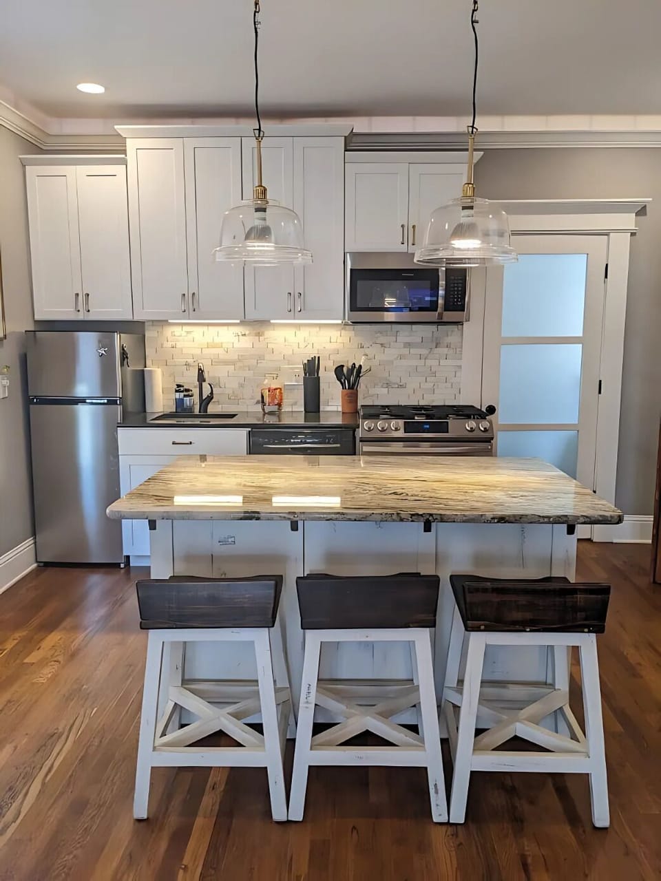 Full kitchen opens up to the large island for prepping and hanging out! 