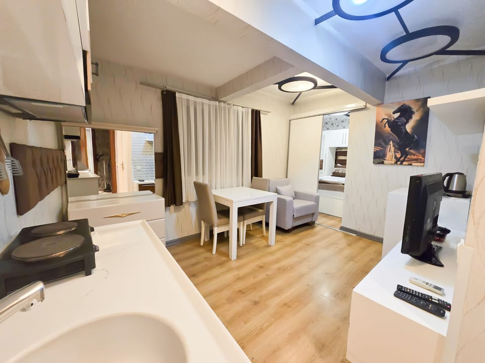 Economy Room | Living area | 30-inch LCD TV with cable channels, heated floors