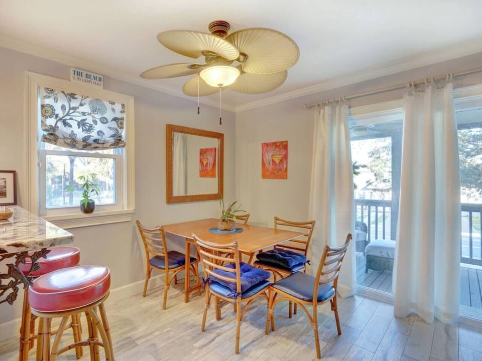 Blue Marlin by You`re On Tybee Tyme Properties. dining area and open kitchen.