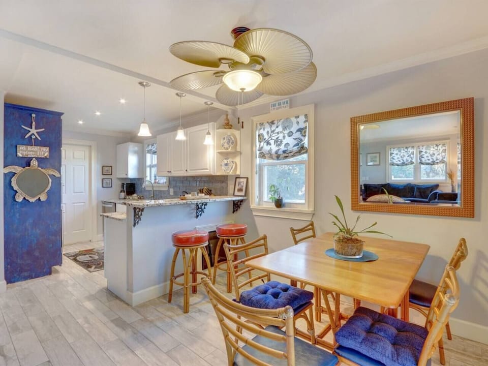 Blue Marlin by You`re On Tybee Tyme Properties. dining area and open kitchen.