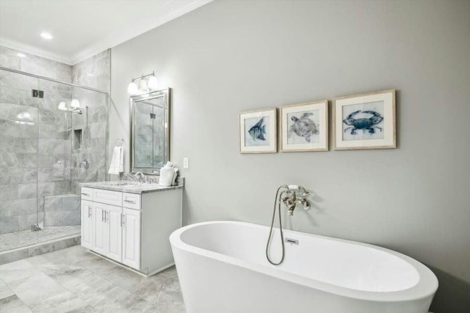 After a fun day on the beach, sink into the soaker tub with a glass of wine.