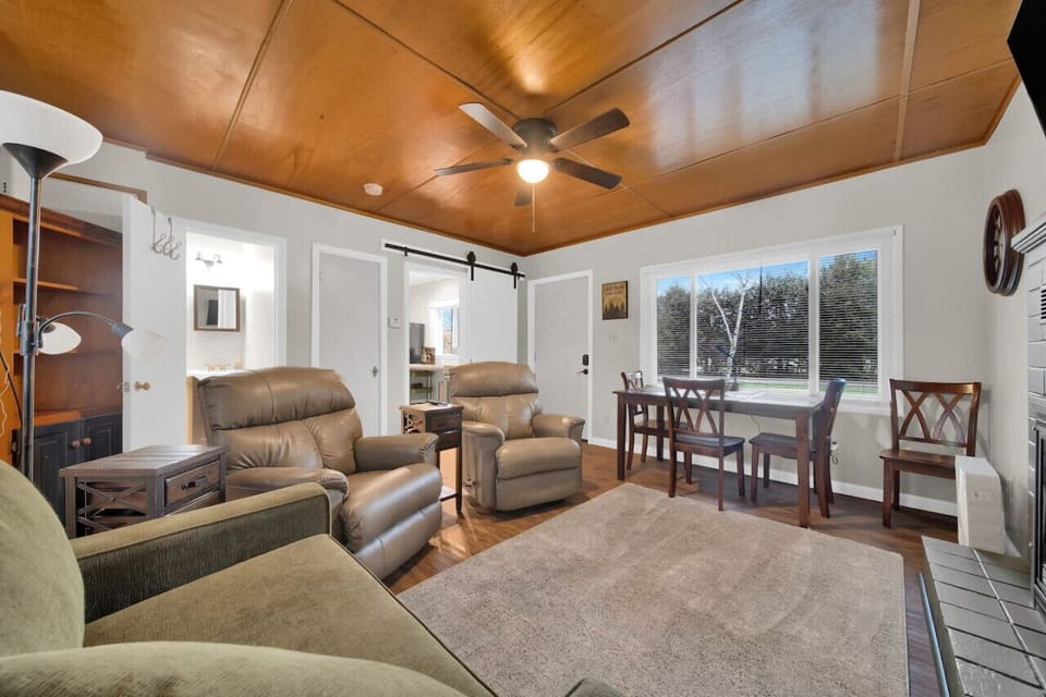 Comfy living room with a tv and fireplace to enjoy when the weather isn`t cooperating!