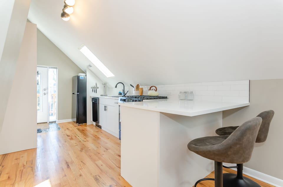 Open kitchen with counter seating for 2