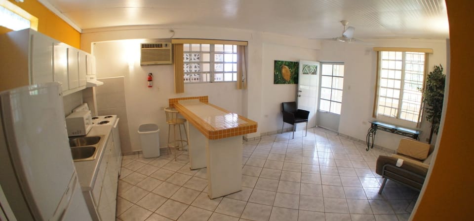 Family Suite, 1 Bedroom | Private kitchen | Fridge, microwave, stovetop, cookware/dishes/utensils