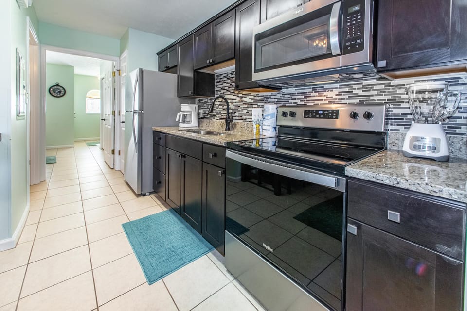Condo, 1 Queen Bed with Sofa bed (Merrimac Resort #32) | Private kitchen | Oven, toaster