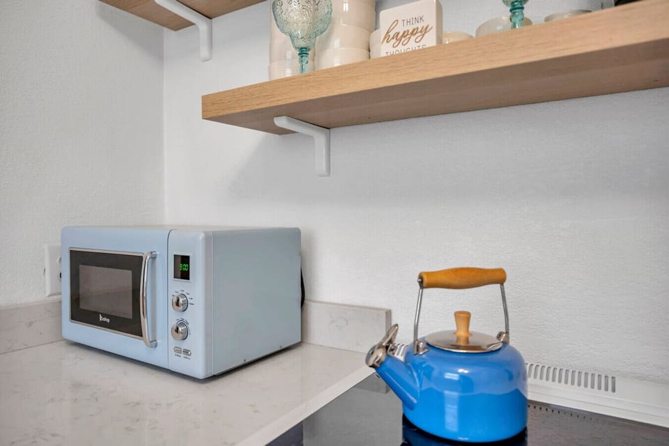 Compact kitchen essentials neatly set up for easy meals and quick snacks.