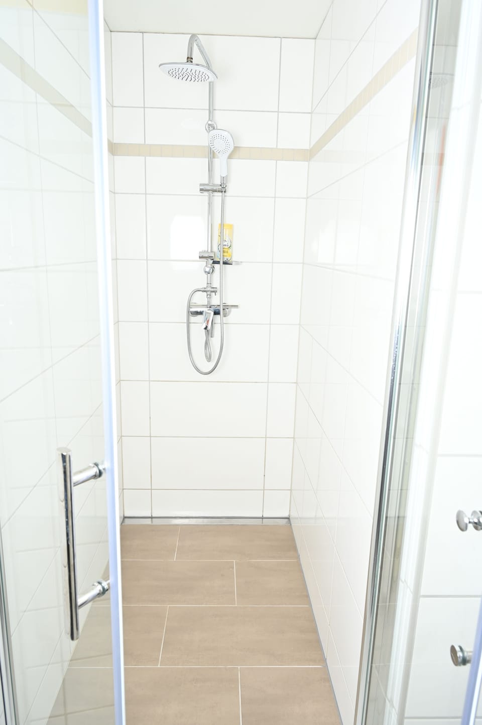 Shower, rainfall showerhead, hair dryer, towels