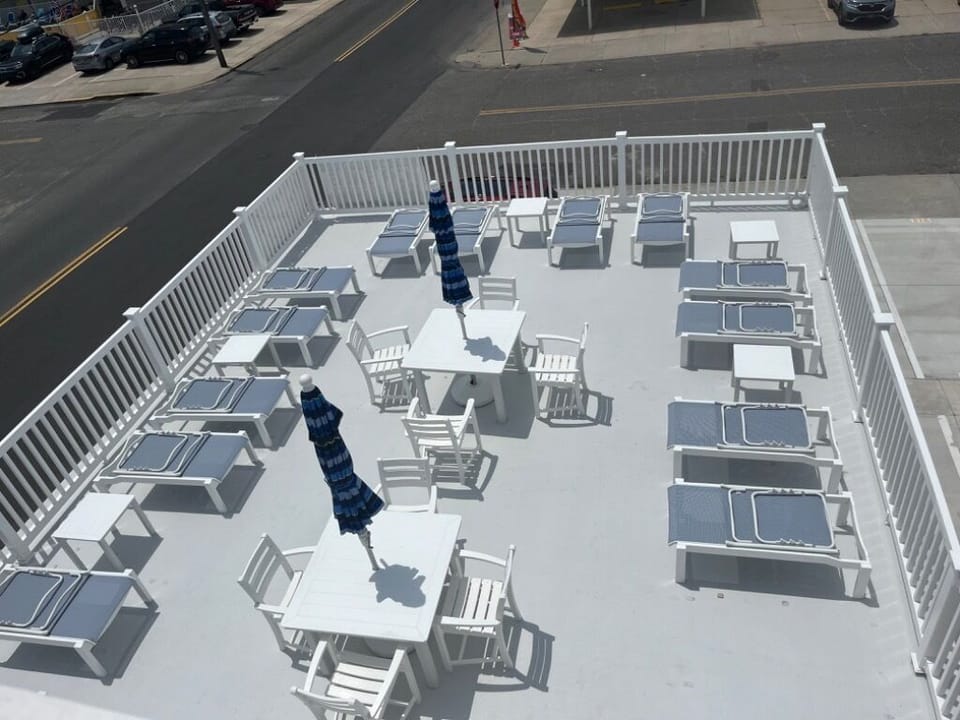 Sundeck with lounge chairs and picnic tables
