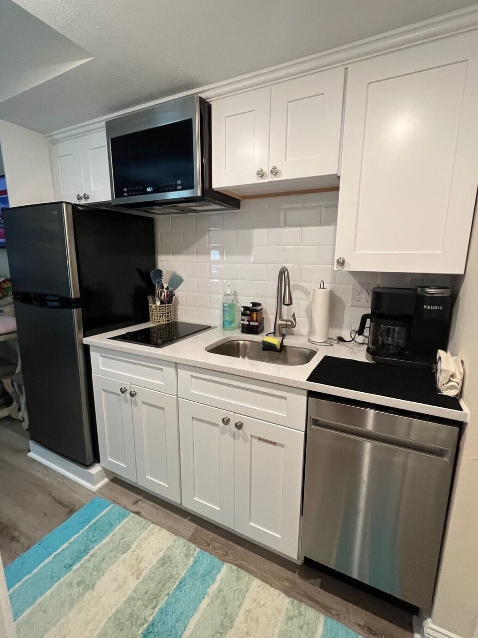 Kitchen with full size refrigerator, dishwasher, electric stovetop, etc.