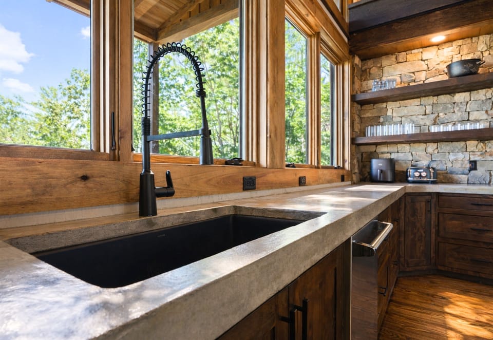 Sunlight pours through every window, framing breathtaking mountain views as you cook, dine, and savor the moment.