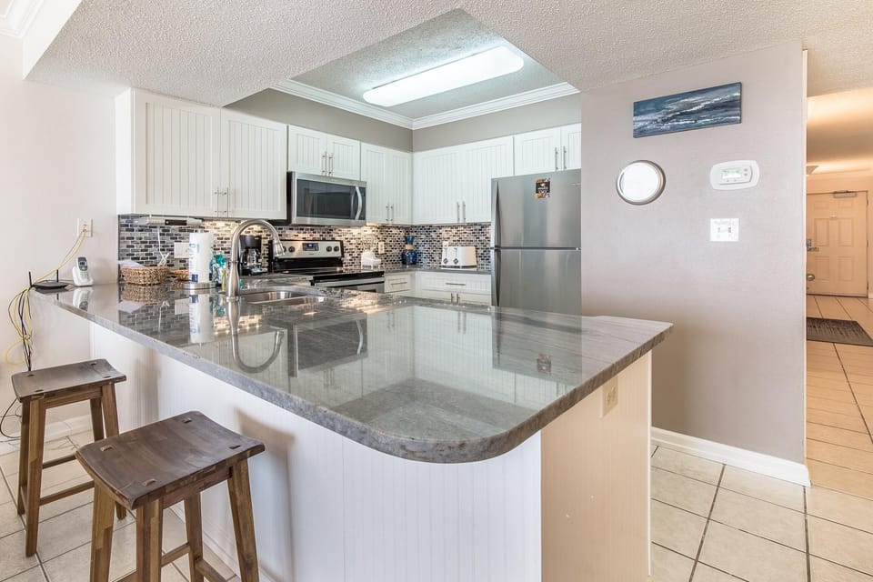 Condo, 1 King Bed with Sofa bed (Pelican Beach Resort 410) | Private kitchen | Oven, toaster