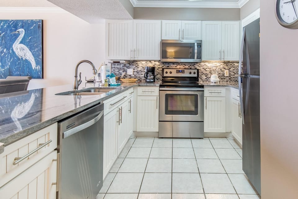 Condo, 1 King Bed with Sofa bed (Pelican Beach Resort 410) | Private kitchen | Oven, toaster