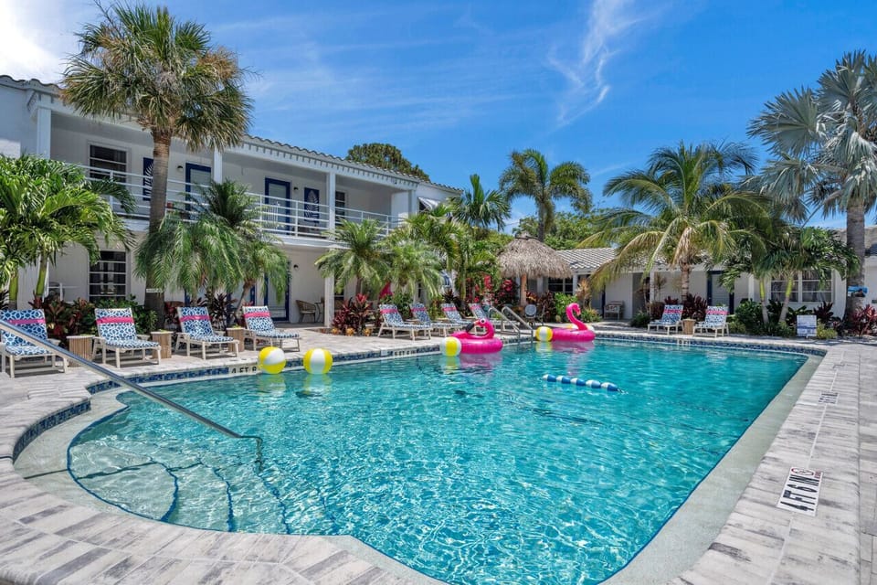Sparkling resort-style pool w/ palm-lined deck and plenty of space to soak up the sun