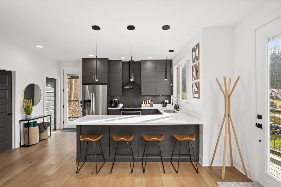 Fully stocked kitchen, including electric kettle, coffee maker, and coffee.