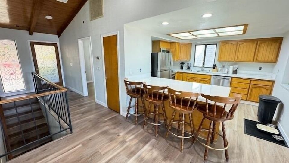 Well stocked kitchen and comfy bar seating.