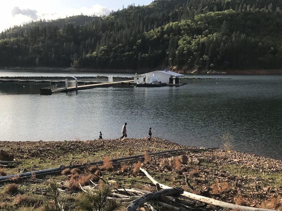 Boys fishing off the Sugarloaf shoreline.