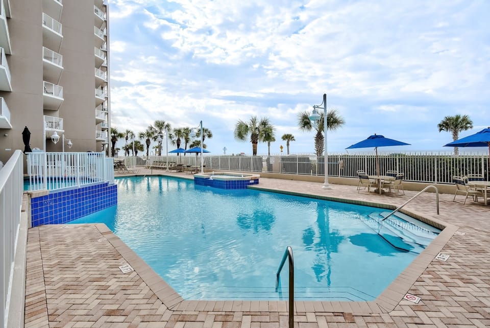 Majestic Sun has a large pool, two hot tubs on the elevated, and spacious patio with plenty of seating and shade overlooking the shimmering Gulf of Mexico.
