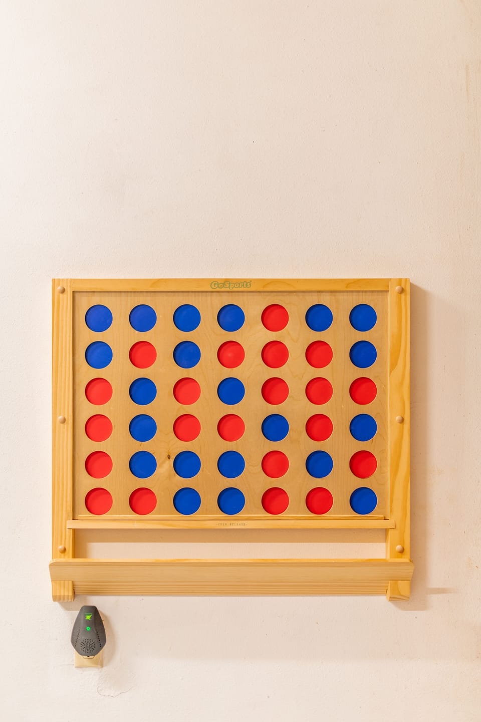 Over sized Connect 4 Game mounted on wall. 