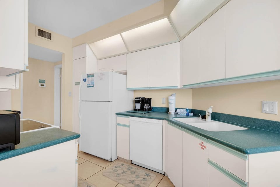 Condo, Multiple Beds (Surfside Resort #1103) | Private kitchen | Oven, toaster