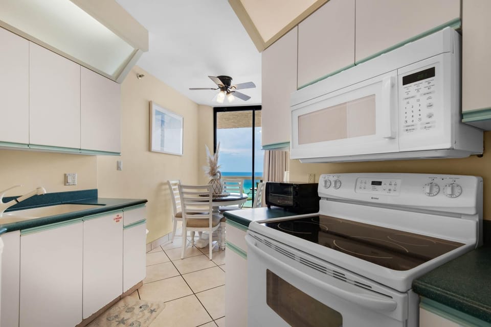 Condo, Multiple Beds (Surfside Resort #1103) | Private kitchen | Oven, toaster