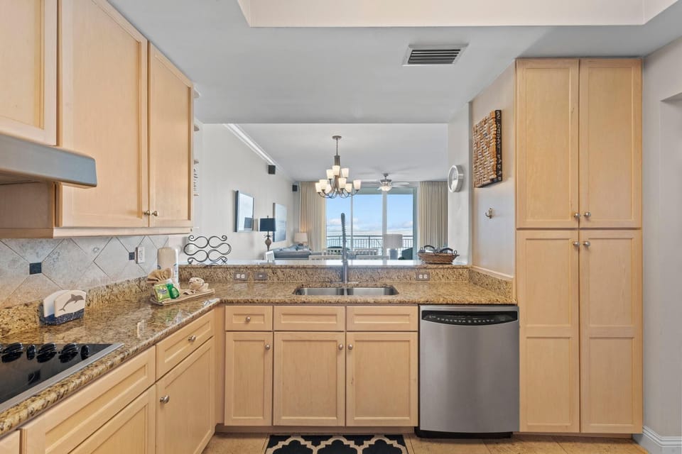Condo, Multiple Beds (Indigo East 605) | Private kitchen | Oven, toaster, paper towels