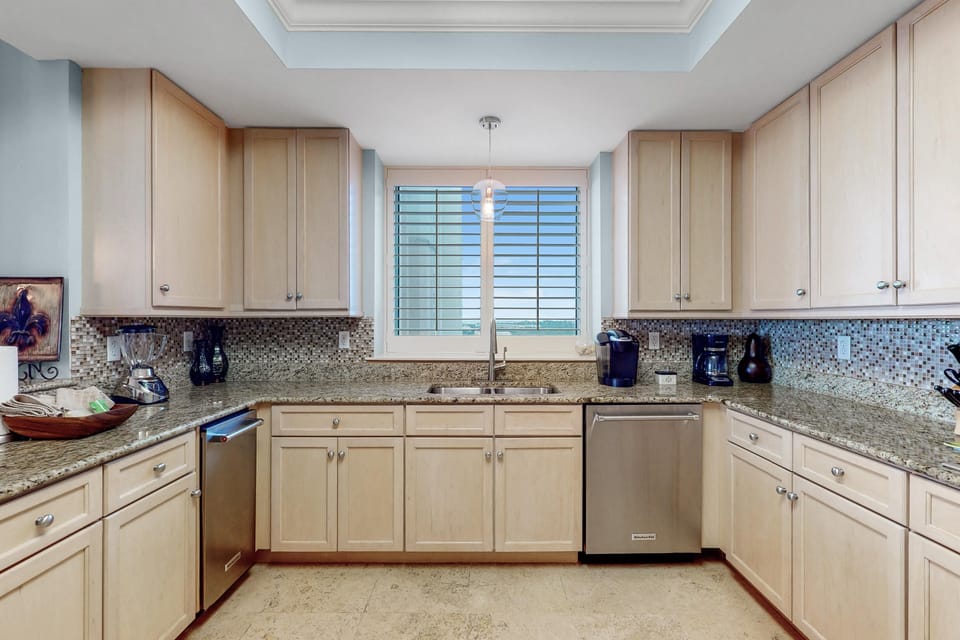 Condo, Multiple Beds (Indigo East 606) | Private kitchen | Oven, toaster, paper towels