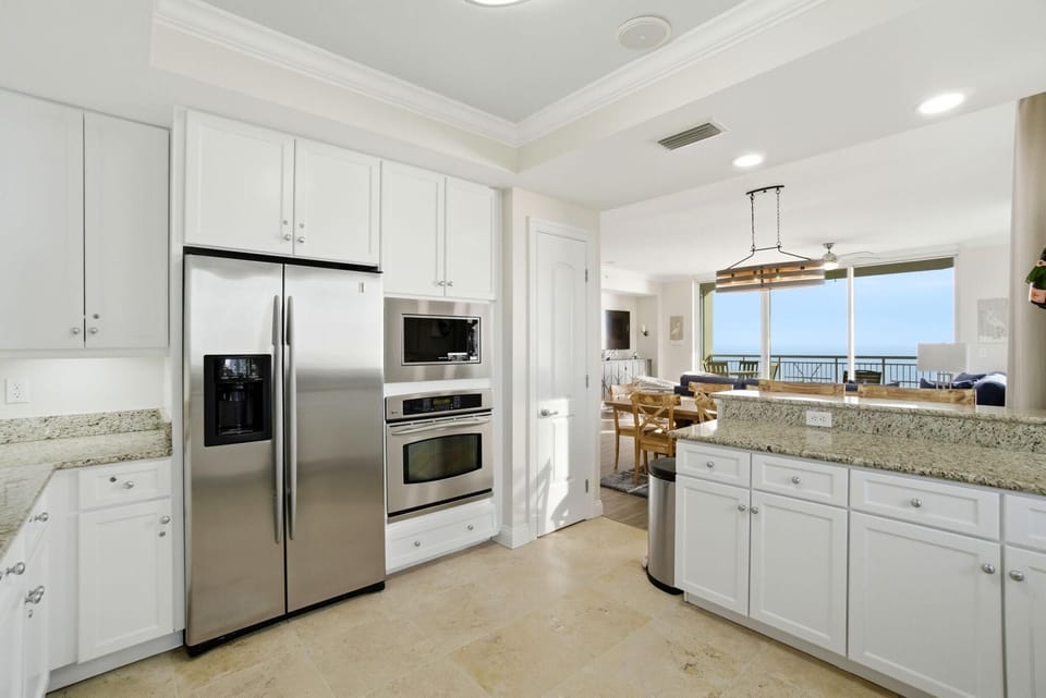 Condo, Multiple Beds (Indigo East 1006) | Private kitchen | Oven, toaster, paper towels