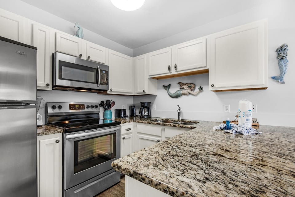 Condo, 1 Queen Bed with Sofa bed (Grand Caribbean West 303) | Private kitchen | Oven, toaster