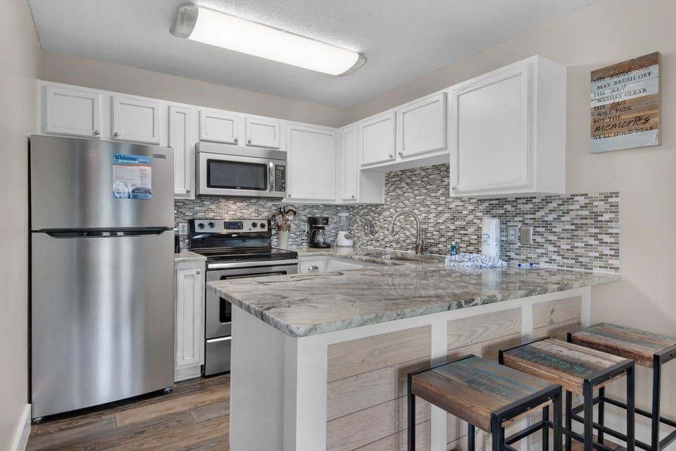 Condo, 1 Queen Bed with Sofa bed (Grand Caribbean West 111- Just Beach ) | Private kitchen | Oven, toaster