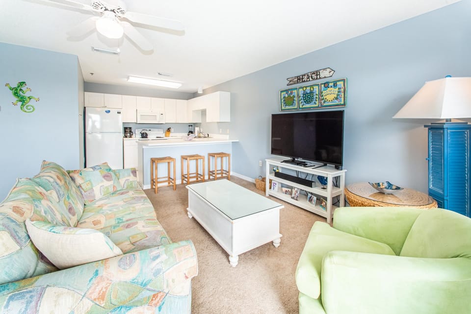Condo, Multiple Beds (Gulf Place Caribbean 309) | Living area | TV