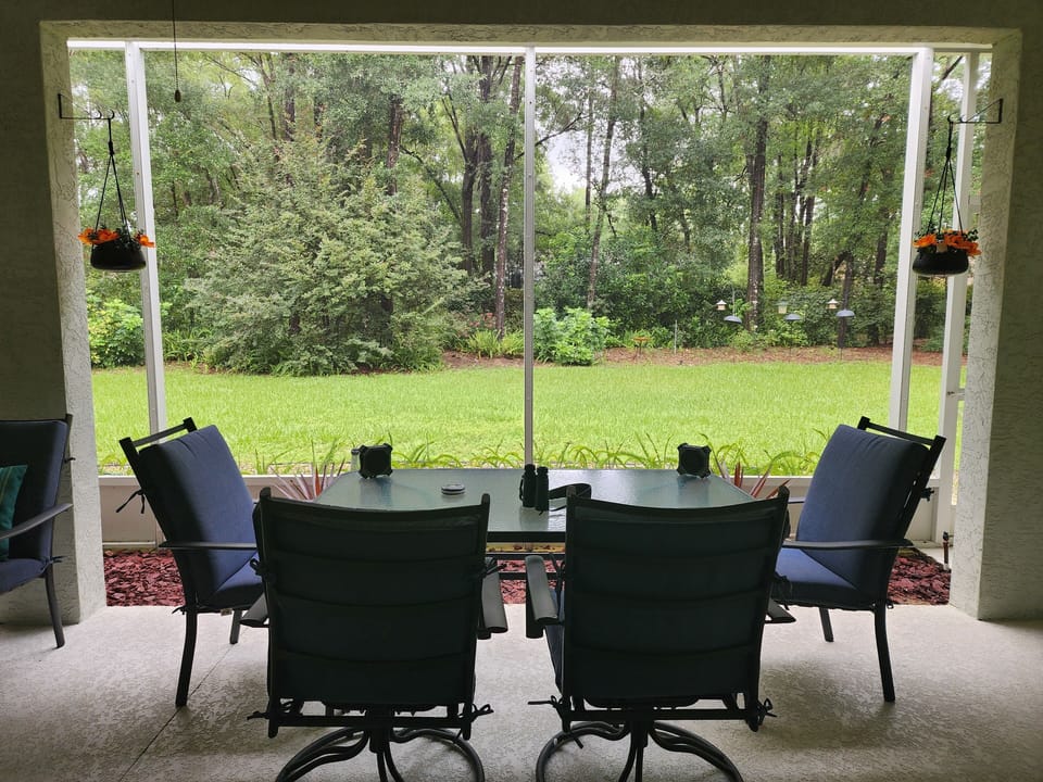 Lanai is covered, screened, and has fans
