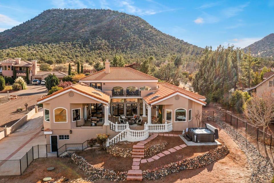 Aerial view of Villa of the Rocks showcasing the private setting, expansive outdoor spaces, and stunning Sedona red rock surroundings.