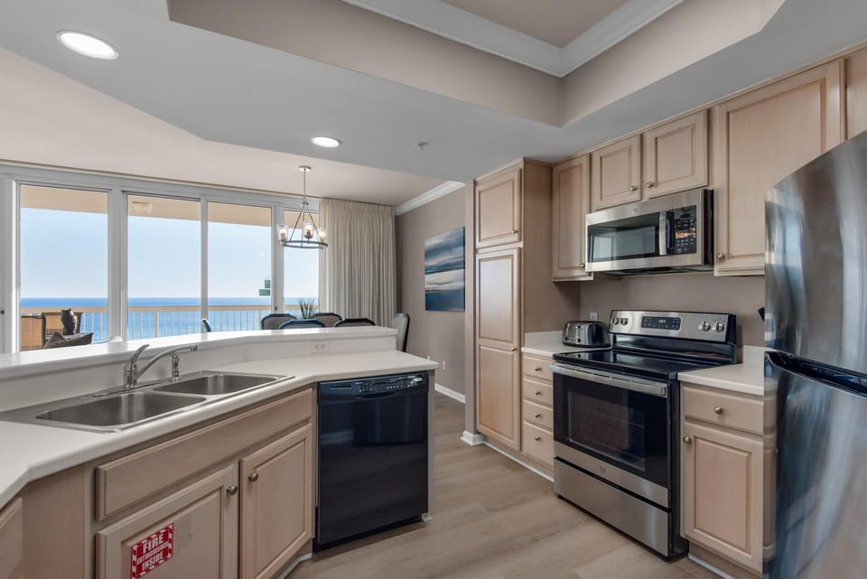 Condo, Multiple Beds (Silver Beach Towers 603 East) | Private kitchen | Oven, toaster